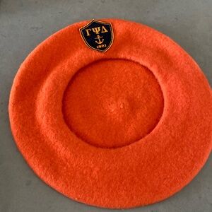 Orange wool beret with cute badge
